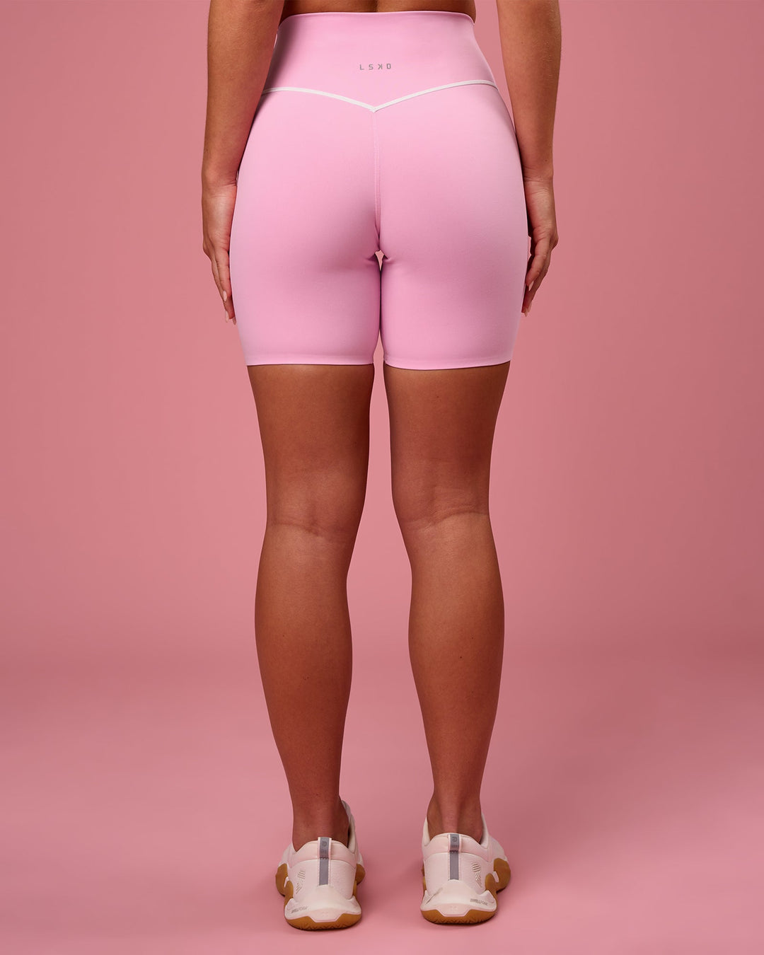 Woman wearing Pinnacle High-Rise 6" Short - Pink Rose-White | Model:Issy | Size:XS - view 5