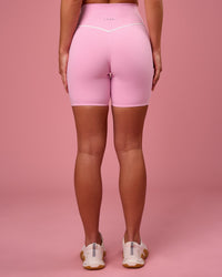 Woman wearing Pinnacle High-Rise 6" Short - Pink Rose-White | Model:Issy | Size:XS | Thumbnail Index: 4