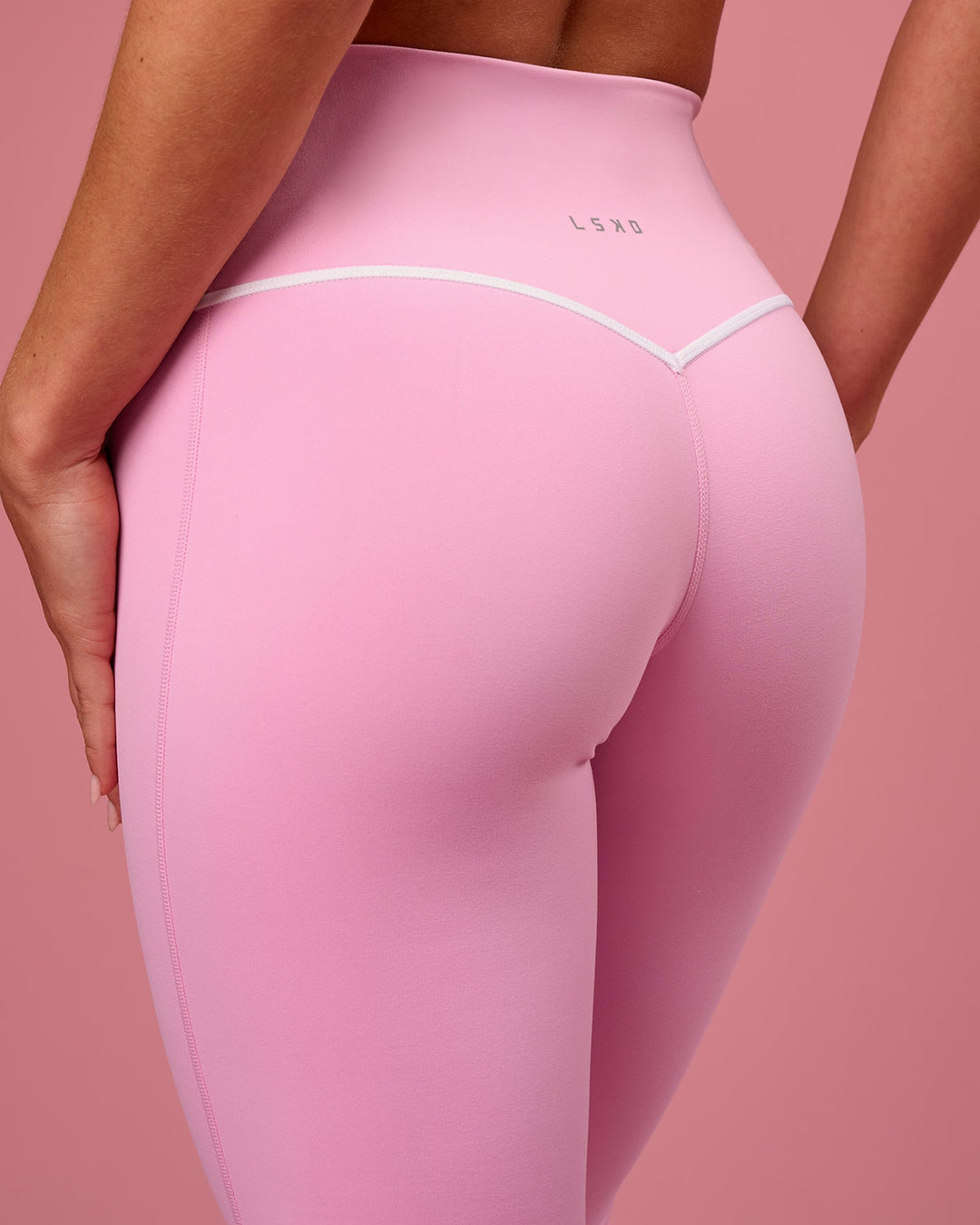 Woman wearing Pinnacle High-Rise Full Length Legging - Pink Rose-White | Model:Issy | Size:XS - view 4