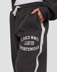Woman wearing Playbook Baggy Cuffed Track Pant - Onyx-Off White | Model:Issy | Size:XS | Thumbnail Index: 8