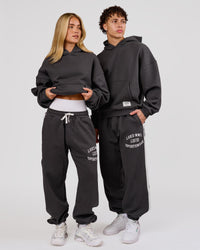 Woman wearing Playbook Baggy Cuffed Track Pant - Onyx-Off White | Model:Issy | Size:XS | Thumbnail Index: 11