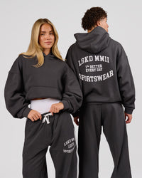 Woman wearing Playbook Boxy Hoodie - Onyx-Off White | Model:Issy | Size:XS | Thumbnail Index: 0