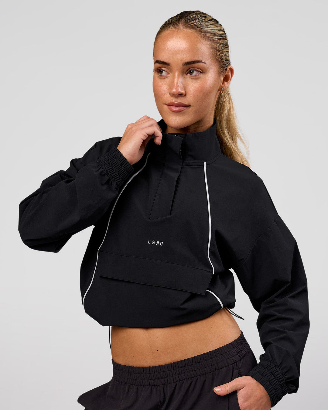 Woman wearing Pop Over Jacket - Black | Model:Issy | Size:XS - view 3