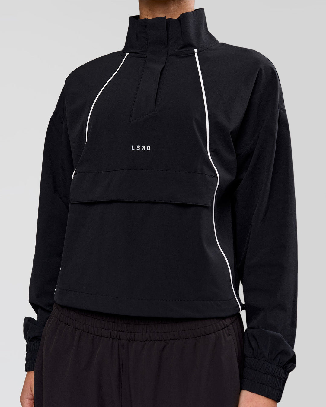 Woman wearing Pop Over Jacket - Black | Model:Issy | Size:XS - view 2