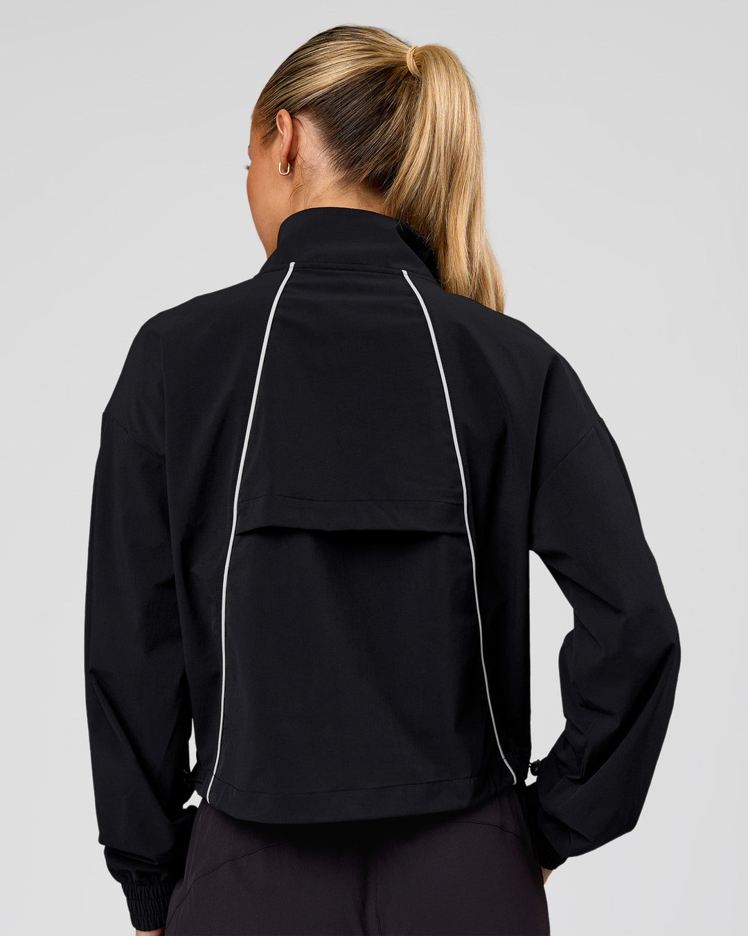 Woman wearing Pop Over Jacket - Black | Model:Issy | Size:XS - view 5