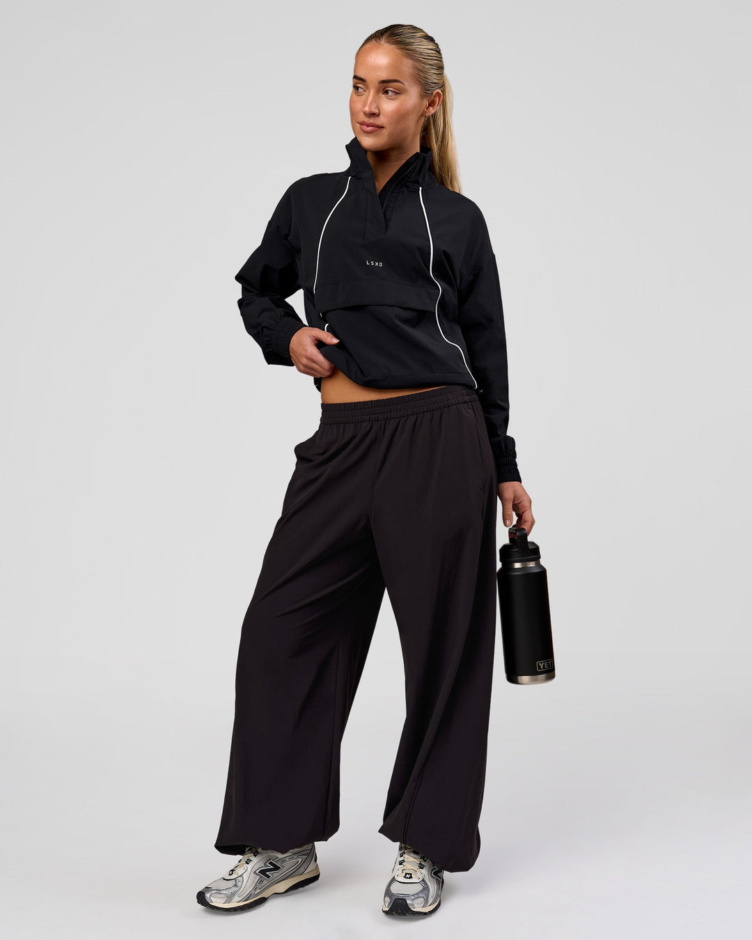 Woman wearing Pop Over Jacket - Black | Model:Issy | Size:XS - view 11