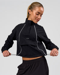 Woman wearing Pop Over Jacket - Black | Model:Issy | Size:XS | Thumbnail Index: 0