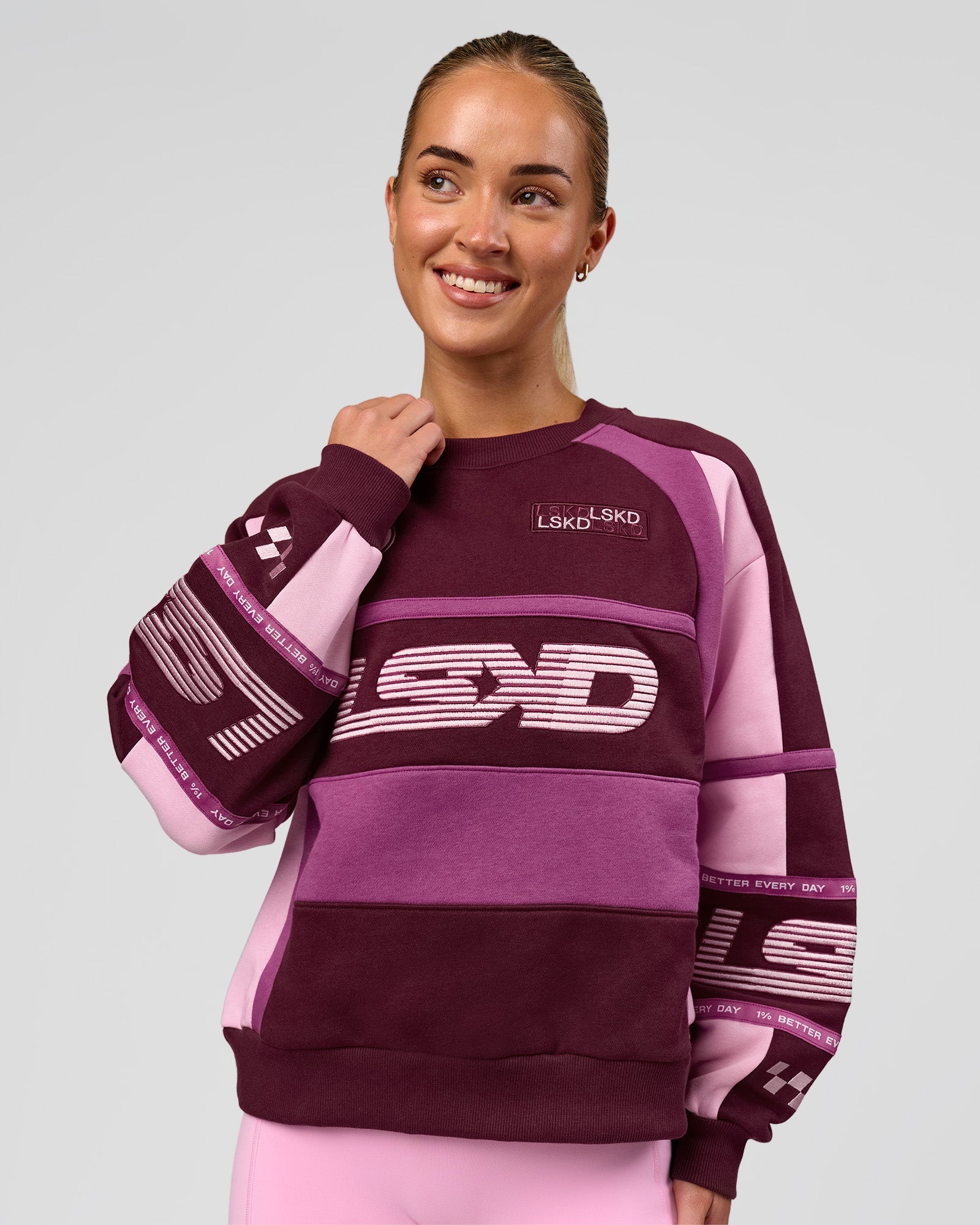 Woman wearing Power Sweater - Cherry Lacquer-Boysenberry | Model:Issy | Size:XS