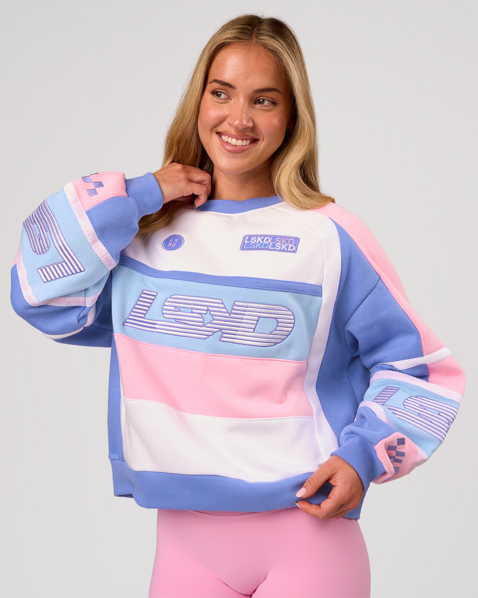 Woman wearing Power Sweater - Pink Rose-Bluebell | Model:Issy | Size:XS
