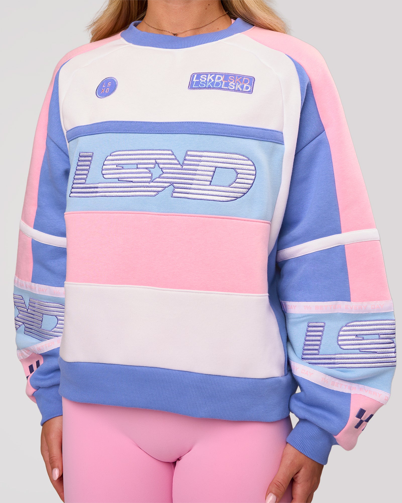 Woman wearing Power Sweater - Pink Rose-Bluebell | Model:Issy | Size:XS