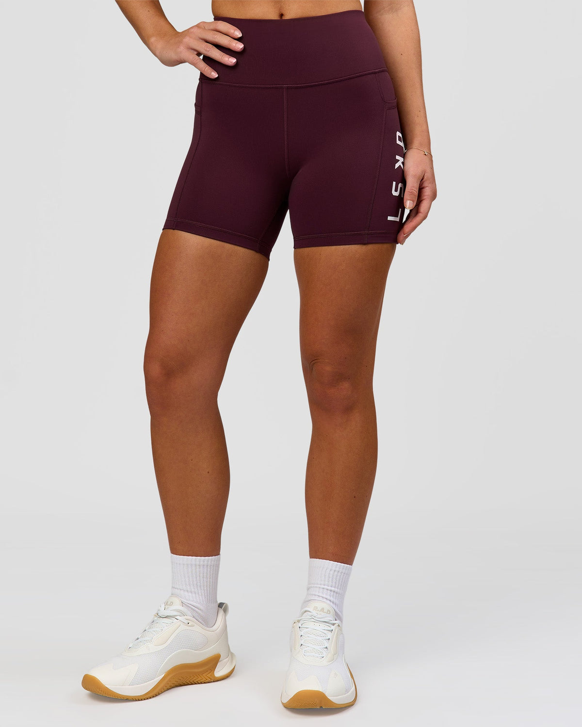 Woman wearing Rep Ultra High-Rise 4" Short Pockets - Cherry Lacquer-White | Model:Issy | Size:XS
