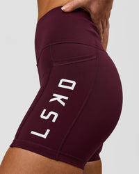 Woman wearing Rep Ultra High-Rise 4" Short Pockets - Cherry Lacquer-White | Model:Issy | Size:XS | Thumbnail Index: 4