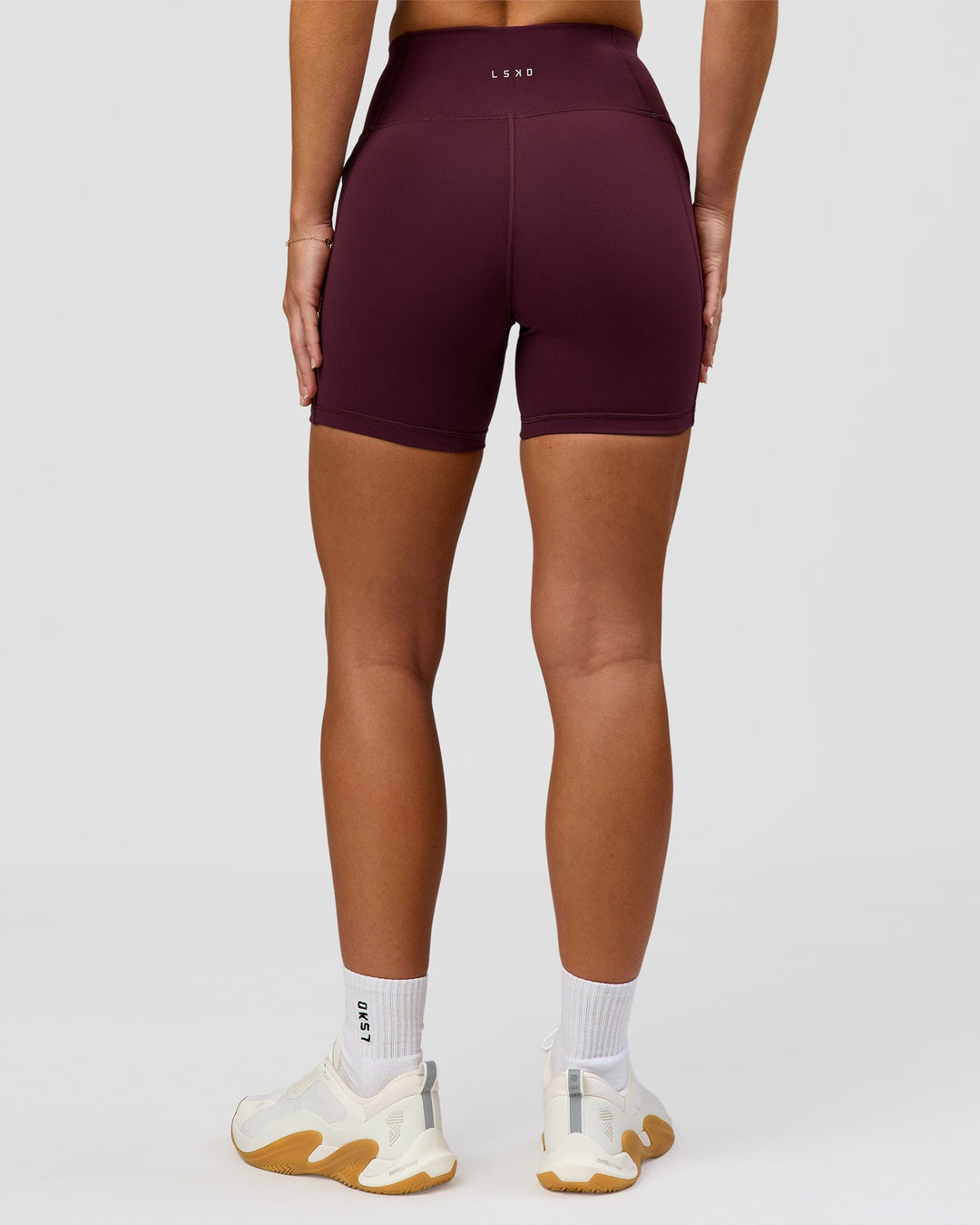 Woman wearing Rep Ultra High-Rise 4" Short Pockets - Cherry Lacquer-White | Model:Issy | Size:XS - view 8
