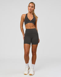 Woman wearing Rep Ultra High-Rise 4" Short Pockets - Onyx-White | Model:Issy | Size:XS | Thumbnail Index: 3