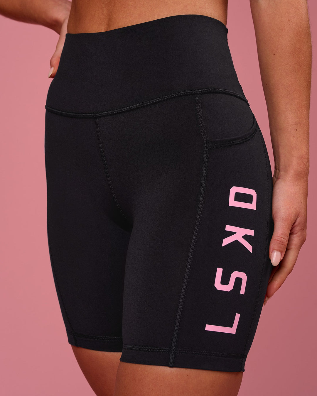 Woman wearing Rep Ultra High-Rise 6" Short Pockets - Black-Pink Rose | Model:Issy | Size:XS - view 4