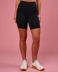 Woman wearing Rep Ultra High-Rise 6" Short Pockets - Black-Pink Rose | Model:Issy | Size:XS | Thumbnail Index: 6
