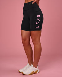 Woman wearing Rep Ultra High-Rise 6" Short Pockets - Black-Pink Rose | Model:Issy | Size:XS | Thumbnail Index: 7