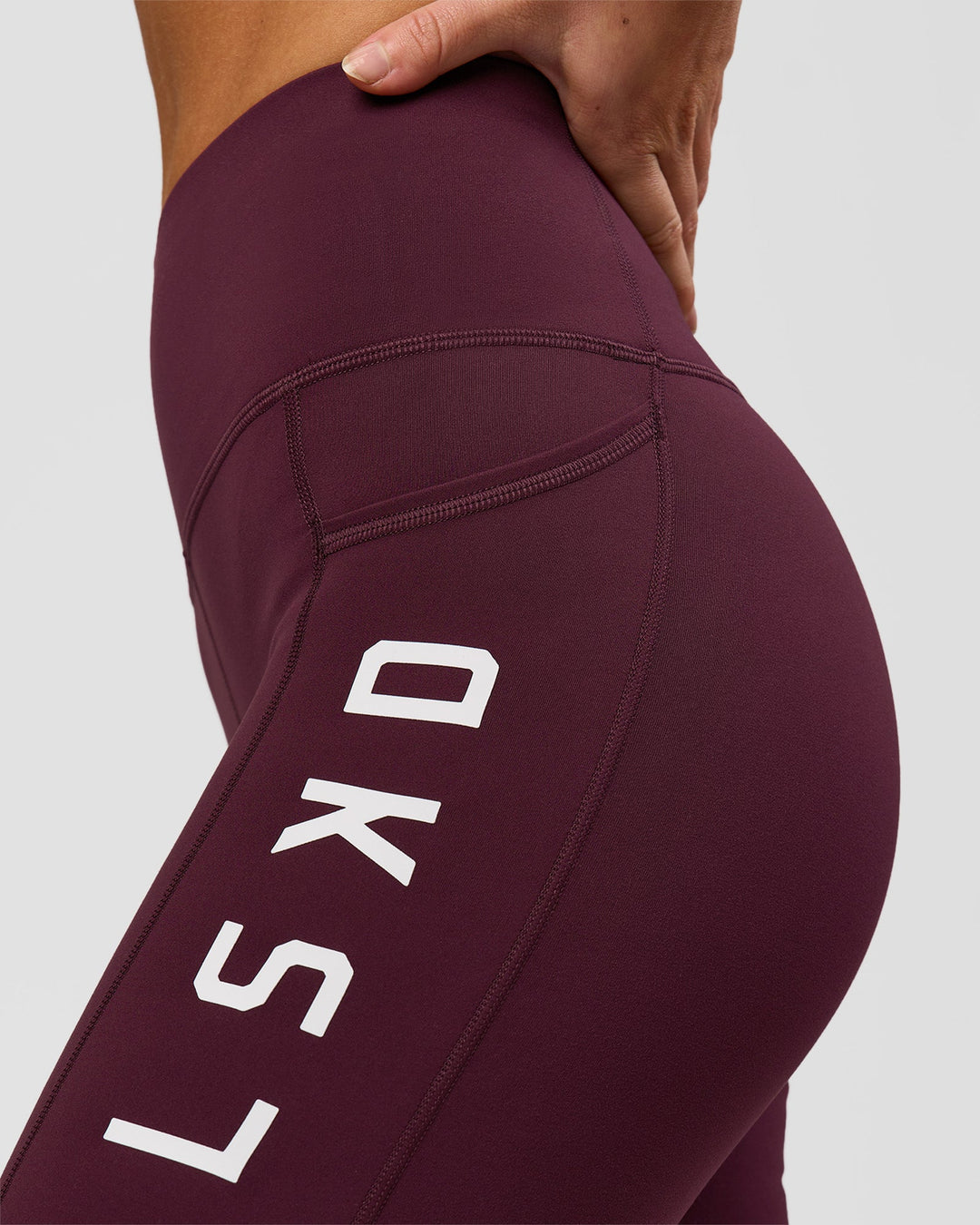 Woman wearing Rep Ultra High-Rise 6" Short Pockets - Cherry Lacquer-White | Model:Issy | Size:XS - view 4
