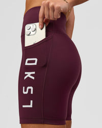 Woman wearing Rep Ultra High-Rise 6" Short Pockets - Cherry Lacquer-White | Model:Issy | Size:XS | Thumbnail Index: 4