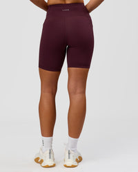 Woman wearing Rep Ultra High-Rise 6" Short Pockets - Cherry Lacquer-White | Model:Issy | Size:XS | Thumbnail Index: 6