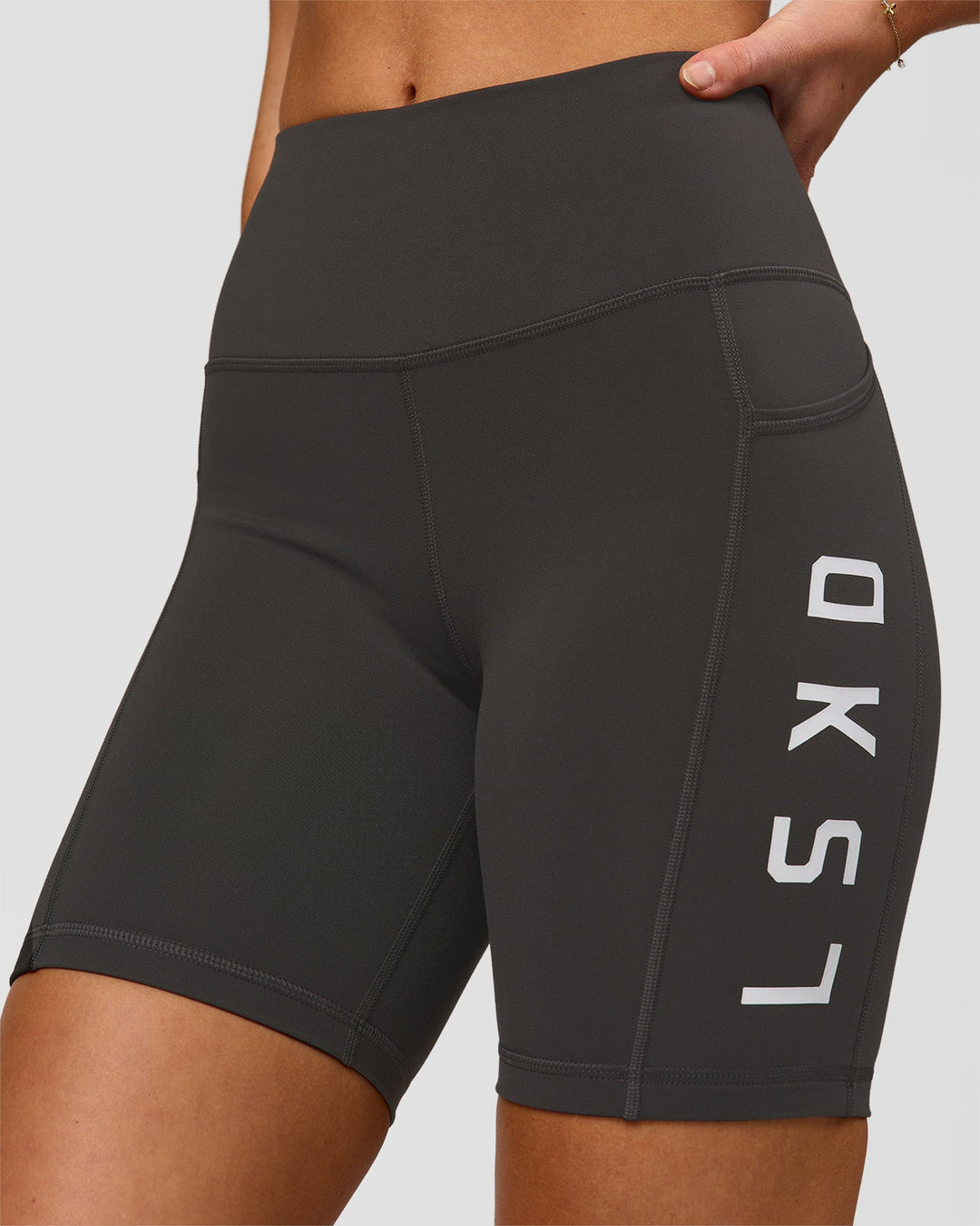 Woman wearing Rep Ultra High-Rise 6" Short Pockets - Onyx-white | Model:Issy | Size:XS - view 3