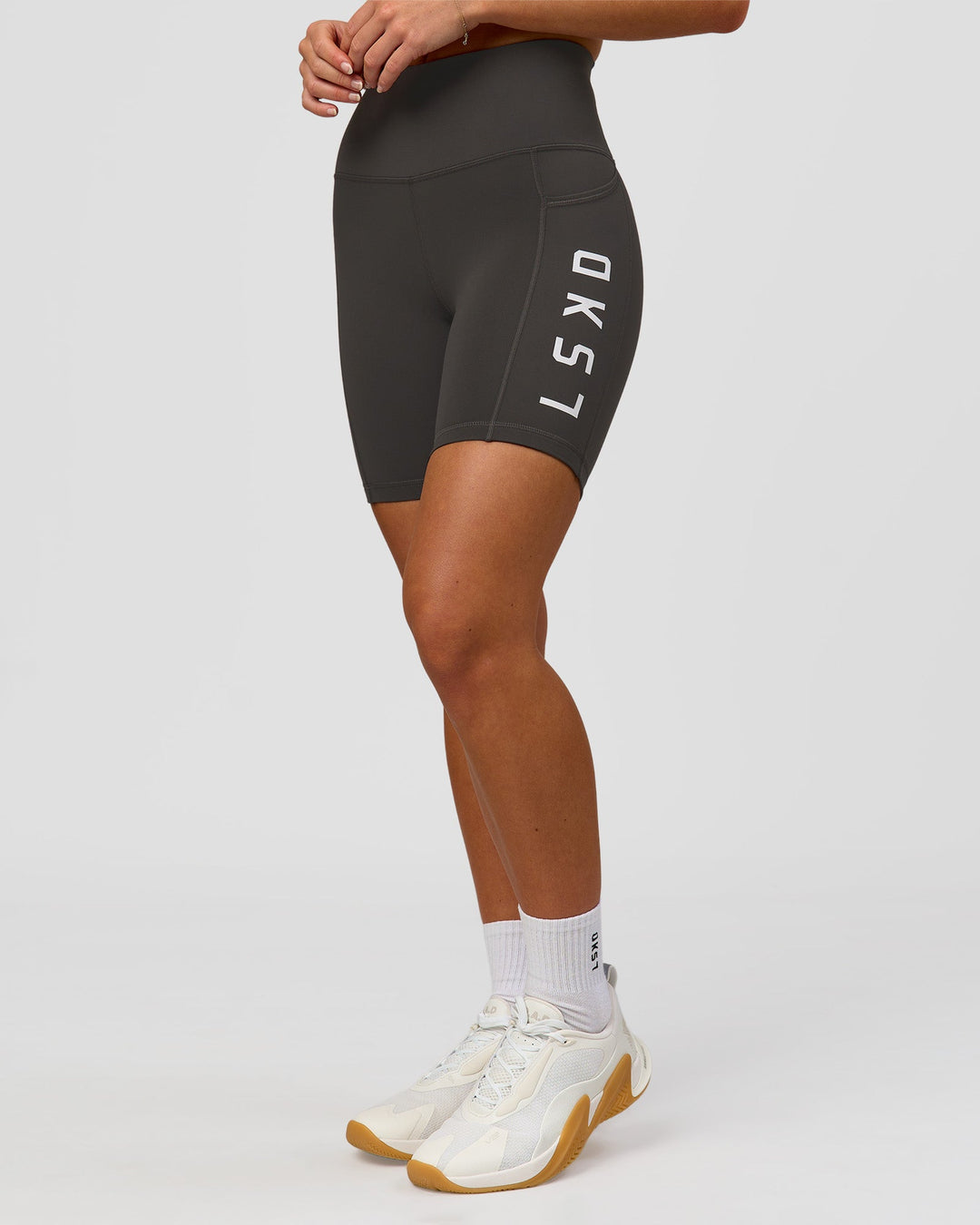 Woman wearing Rep Ultra High-Rise 6" Short Pockets - Onyx-white | Model:Issy | Size:XS - view 4
