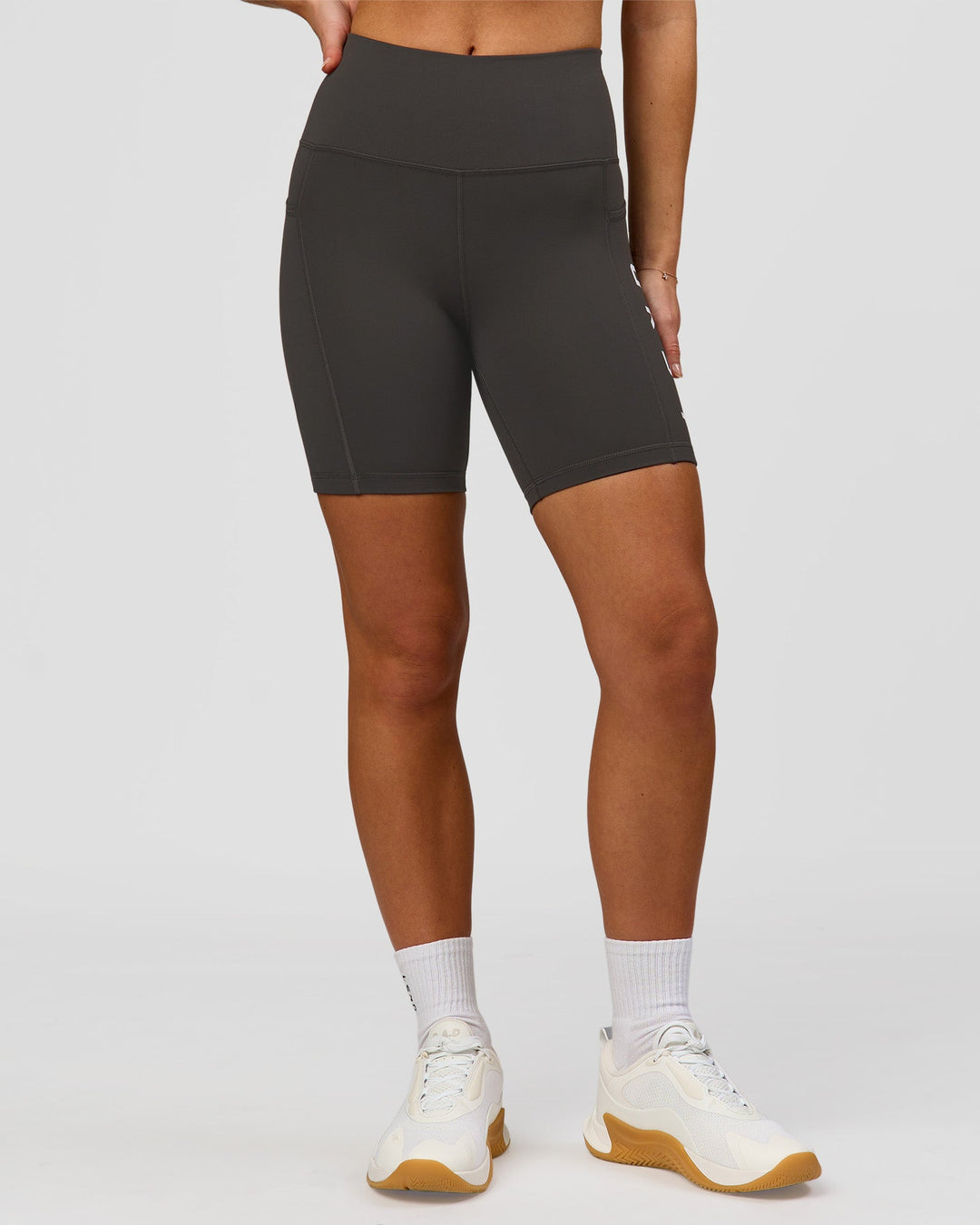 Woman wearing Rep Ultra High-Rise 6" Short Pockets - Onyx-white | Model:Issy | Size:XS - view 5