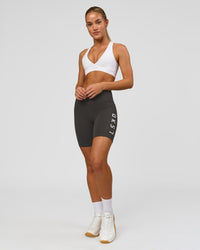 Woman wearing Rep Ultra High-Rise 6" Short Pockets - Onyx-white | Model:Issy | Size:XS | Thumbnail Index: 5