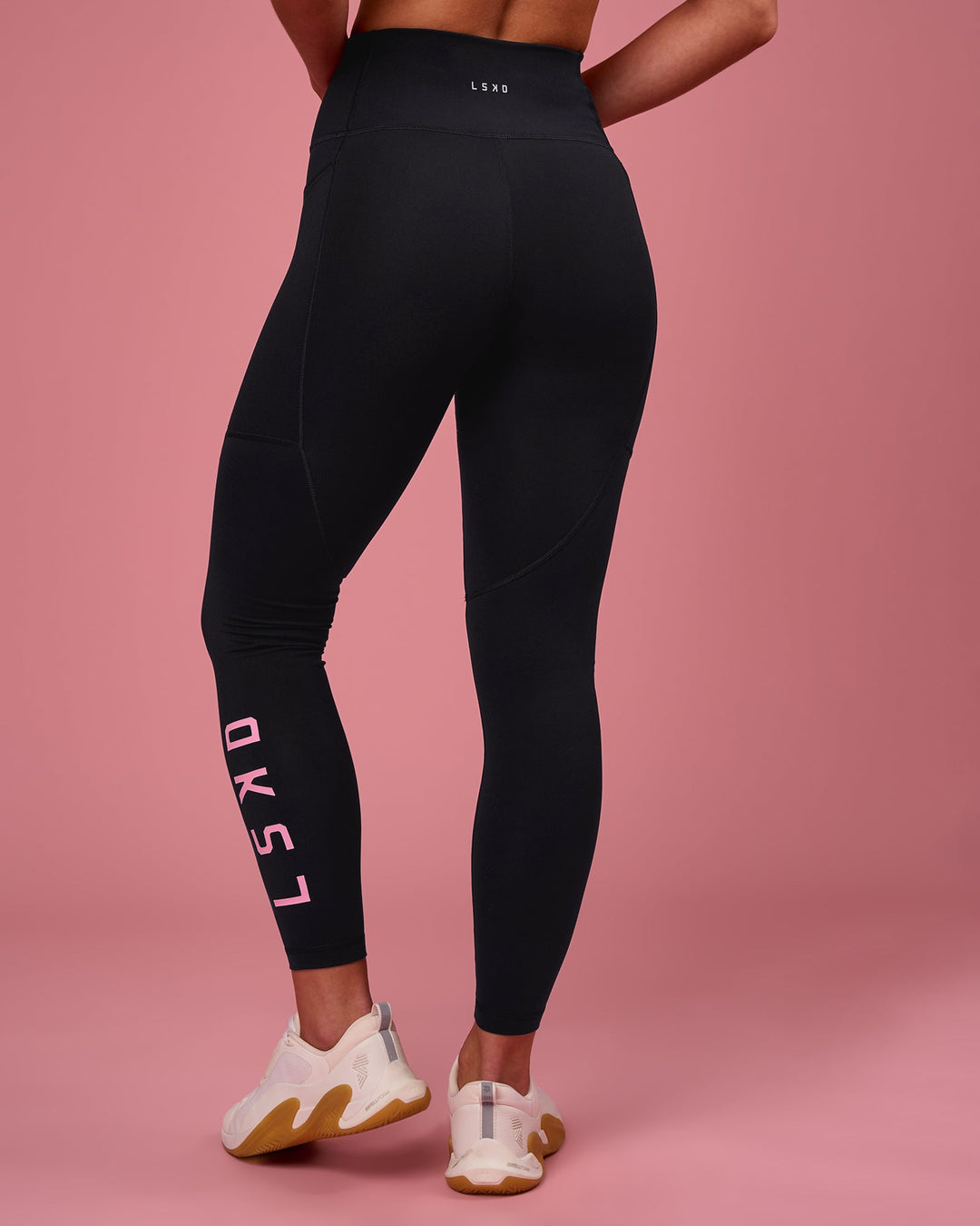 Woman wearing Rep Ultra High-Rise 7/8 Legging Pockets - Black-Pink Rose | Model:Issy | Size:XS - view 4