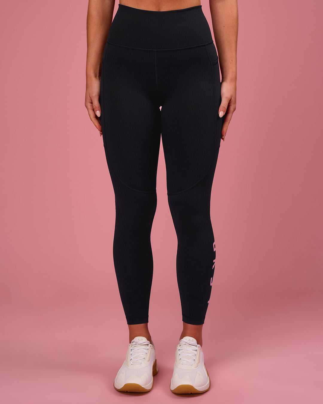 Woman wearing Rep Ultra High-Rise 7/8 Legging Pockets - Black-Pink Rose | Model:Issy | Size:XS - view 3