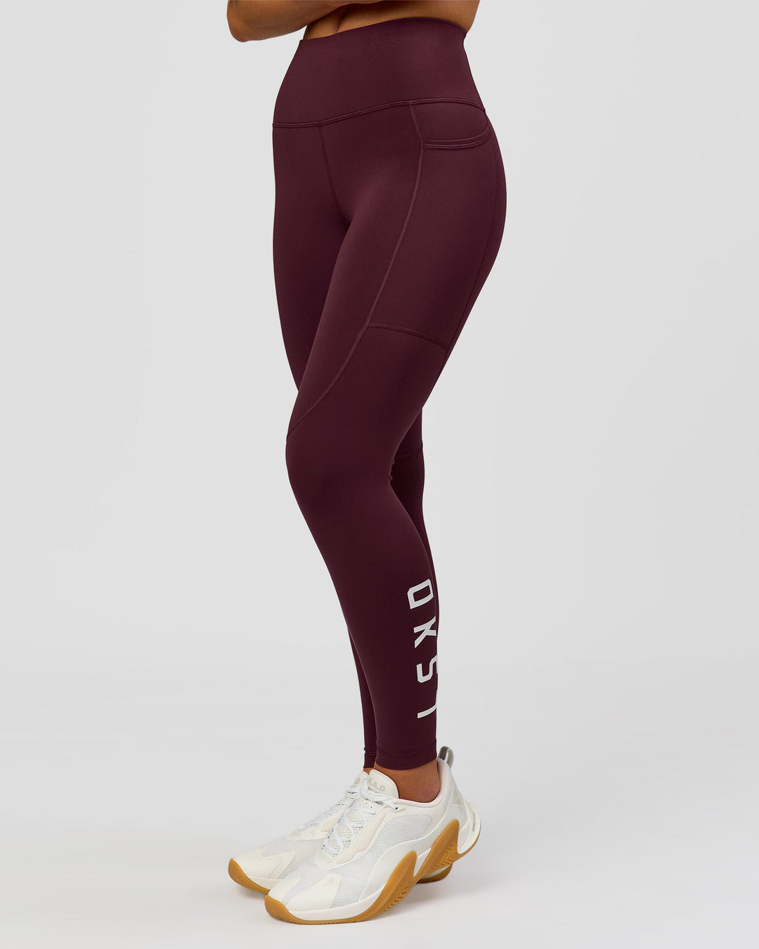 Woman wearing Rep Ultra High-Rise 7/8 Legging Pockets - Cherry Lacquer-White | Model:Issy | Size:XS - view 4