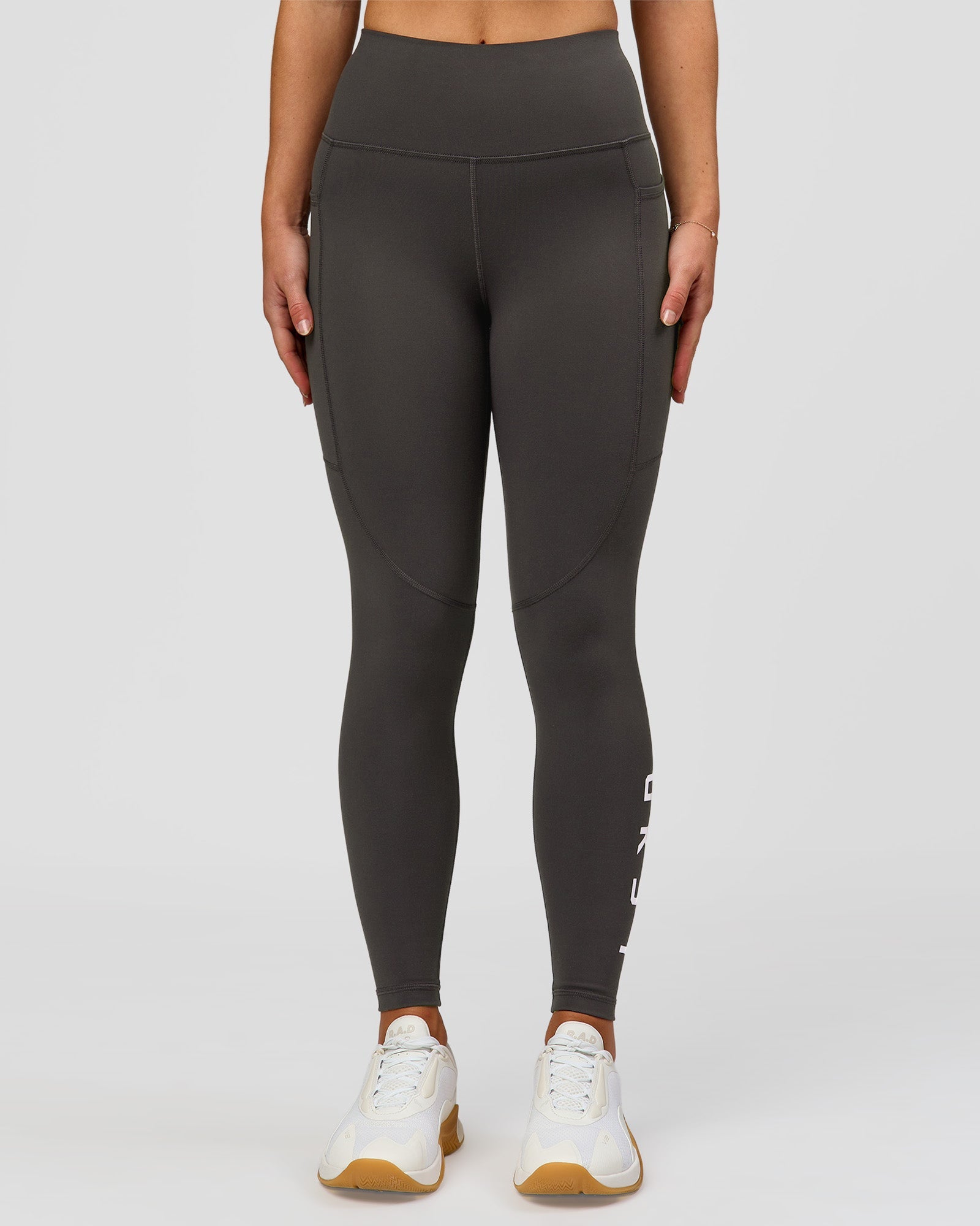 Woman wearing Rep Ultra High-Rise 7/8 Legging Pockets - Onyx-white | Model:Issy | Size:XS