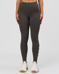 Woman wearing Rep Ultra High-Rise 7/8 Legging Pockets - Onyx-white | Model:Issy | Size:XS | Thumbnail Index: 0