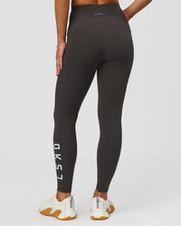 Woman wearing Rep Ultra High-Rise 7/8 Legging Pockets - Onyx-white | Model:Issy | Size:XS | Thumbnail Index: 4