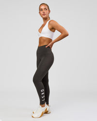 Woman wearing Rep Ultra High-Rise 7/8 Legging Pockets - Onyx-white | Model:Issy | Size:XS | Thumbnail Index: 5