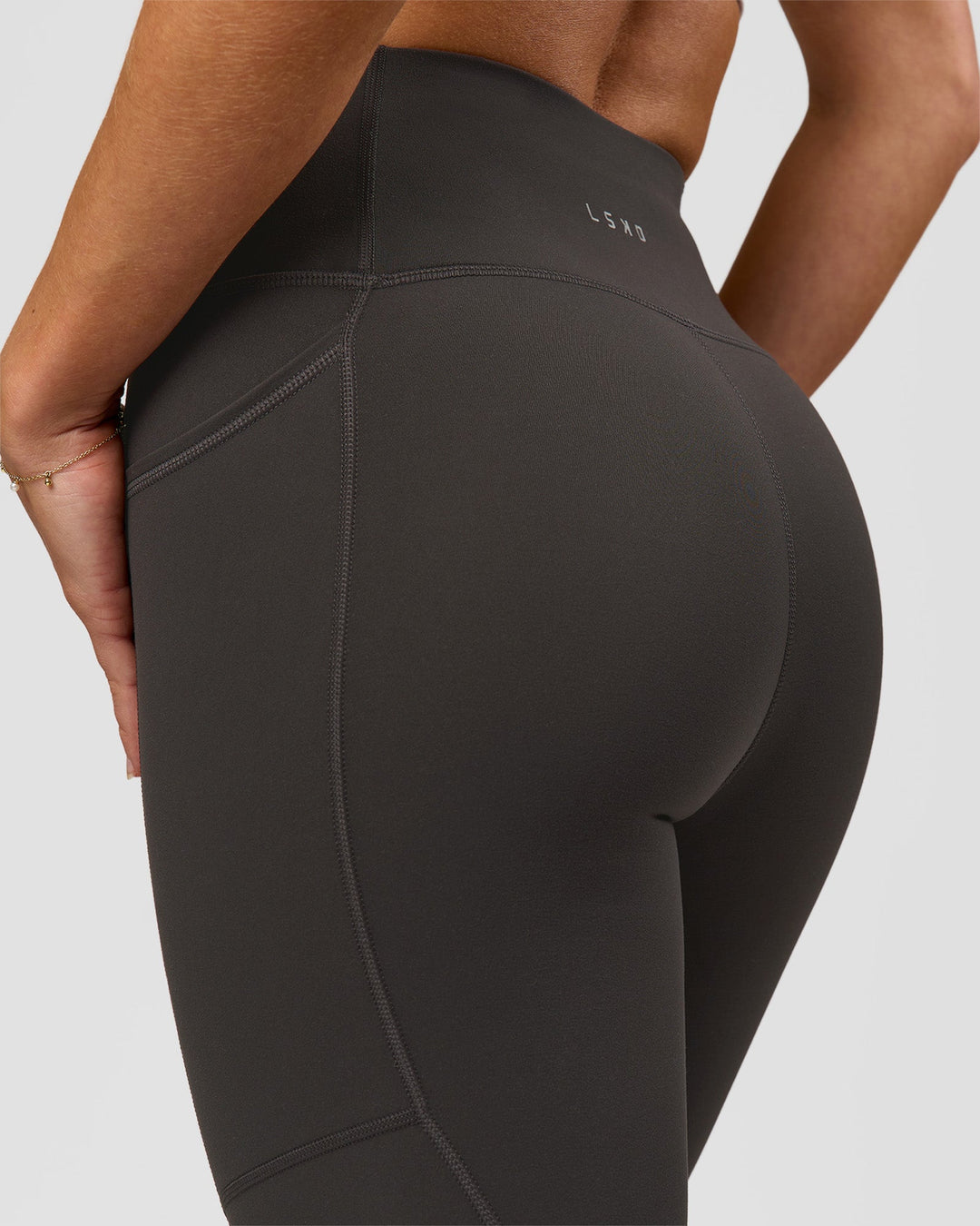 Woman wearing Rep Ultra High-Rise 7/8 Legging Pockets - Onyx-white | Model:Issy | Size:XS - view 7