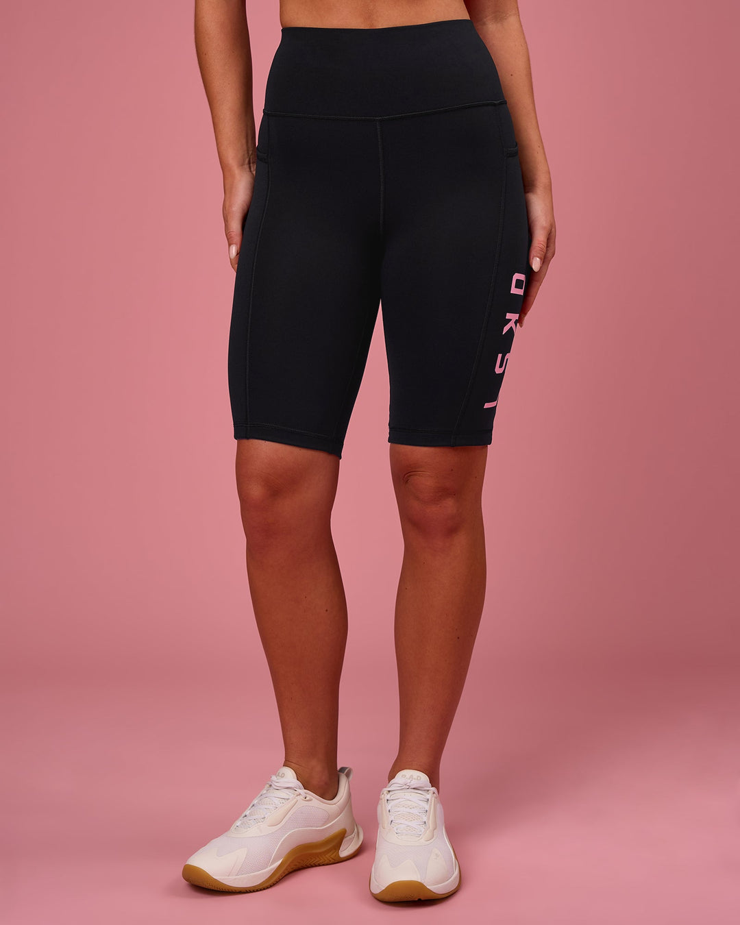 Woman wearing Rep Ultra High-Rise 9" Short Pockets - Black-Pink Rose | Model:Issy | Size:XS - view 5