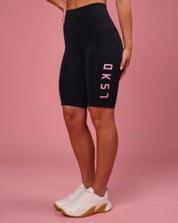Woman wearing Rep Ultra High-Rise 9" Short Pockets - Black-Pink Rose | Model:Issy | Size:XS | Thumbnail Index: 5