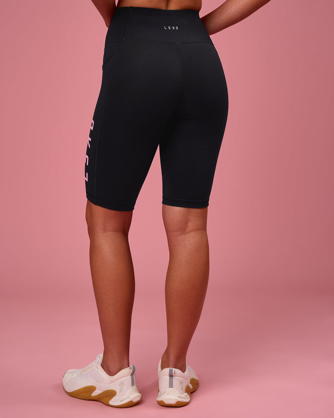 Woman wearing Rep Ultra High-Rise 9" Short Pockets - Black-Pink Rose | Model:Issy | Size:XS - view 8