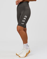 Woman wearing Rep Ultra High-Rise 9" Short Pockets - Onyx-white | Model:Issy | Size:XS | Thumbnail Index: 0