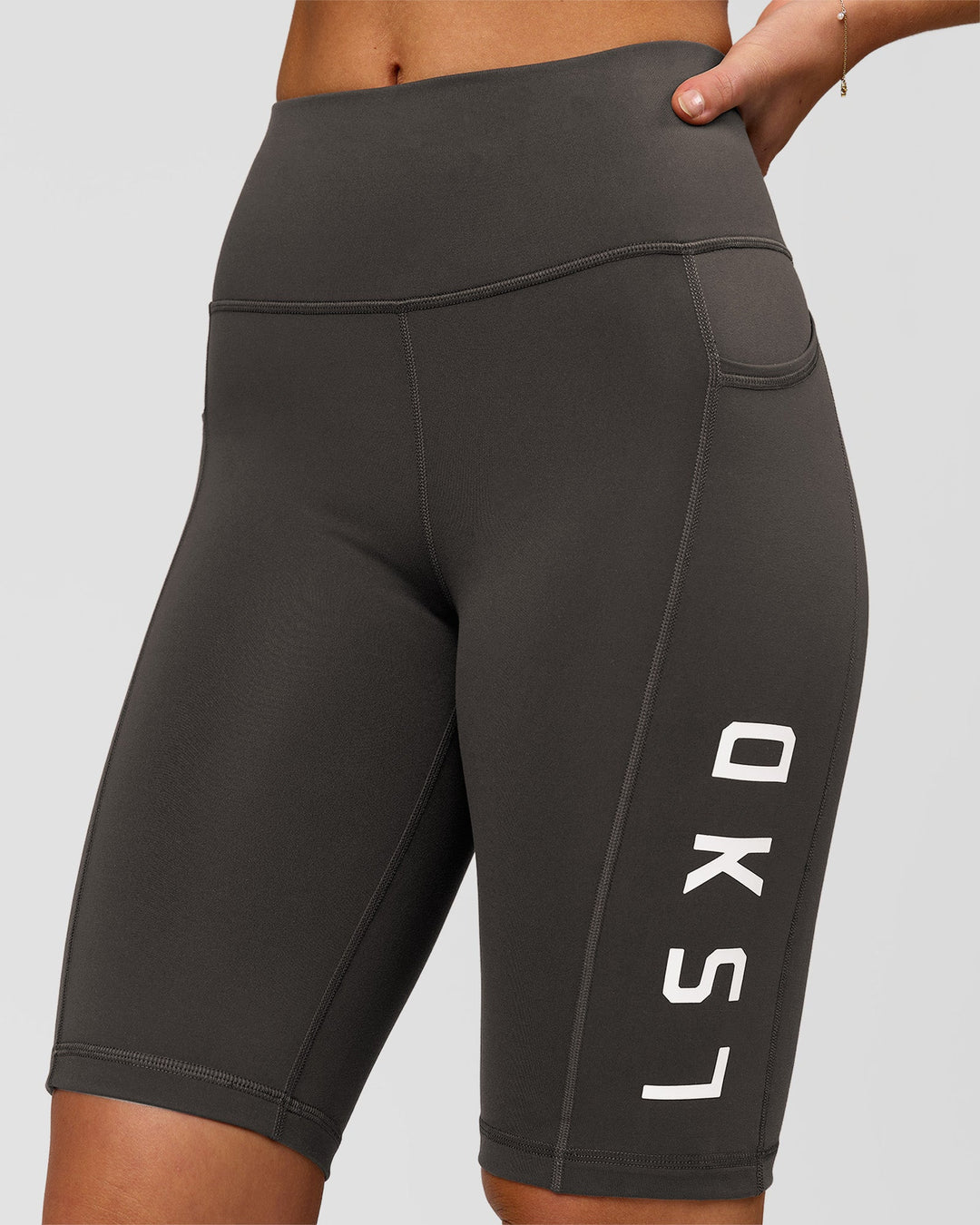 Woman wearing Rep Ultra High-Rise 9" Short Pockets - Onyx-white | Model:Issy | Size:XS - view 3