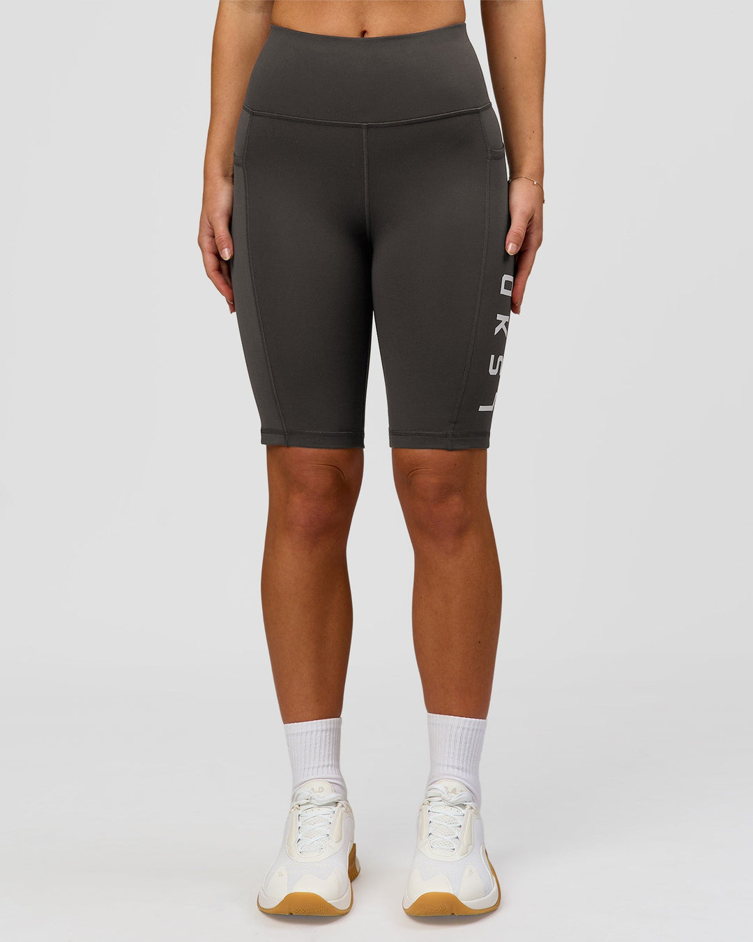 Woman wearing Rep Ultra High-Rise 9" Short Pockets - Onyx-white | Model:Issy | Size:XS - view 4