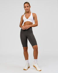 Woman wearing Rep Ultra High-Rise 9" Short Pockets - Onyx-white | Model:Issy | Size:XS | Thumbnail Index: 5