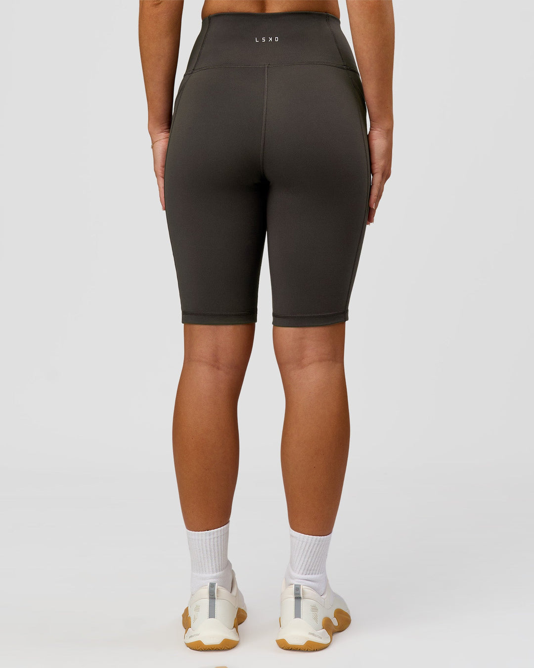 Woman wearing Rep Ultra High-Rise 9" Short Pockets - Onyx-white | Model:Issy | Size:XS - view 8