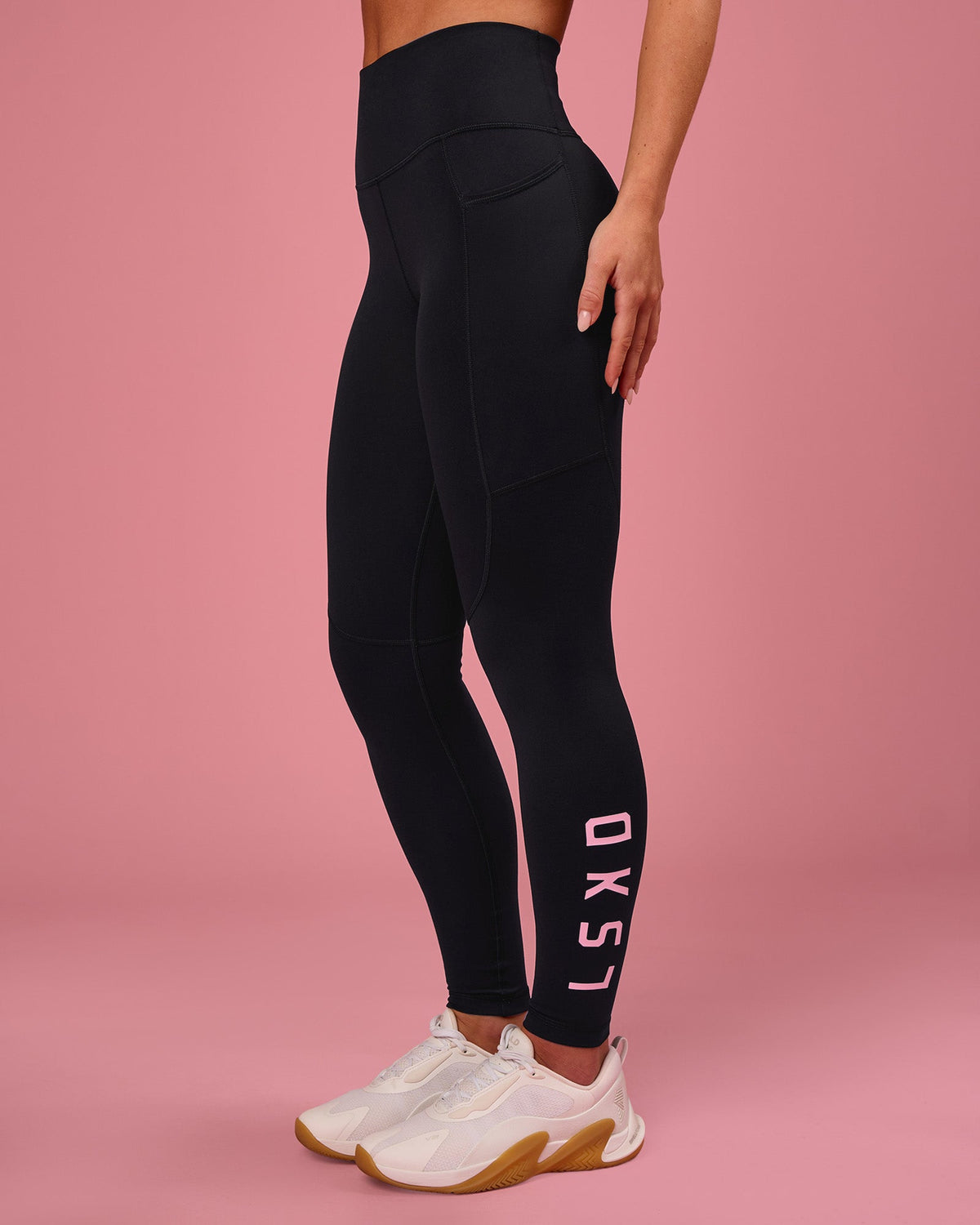 Woman wearing Rep Ultra High-Rise Full Length Legging Pockets - Black-Pink Rose | Model:Issy | Size:XS