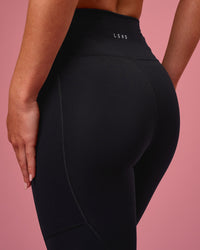 Woman wearing Rep Ultra High-Rise Full Length Legging Pockets - Black-Pink Rose | Model:Issy | Size:XS | Thumbnail Index: 3