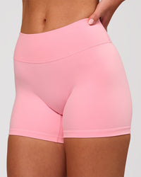 Woman wearing RXD Mid-Rise 4" Short - Pink Rose | Model:Issy | Size:XS | Thumbnail Index: 0