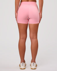 Woman wearing RXD Mid-Rise 4" Short - Pink Rose | Model:Issy | Size:XS | Thumbnail Index: 3