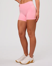 Woman wearing RXD Mid-Rise 4" Short - Pink Rose | Model:Issy | Size:XS | Thumbnail Index: 4