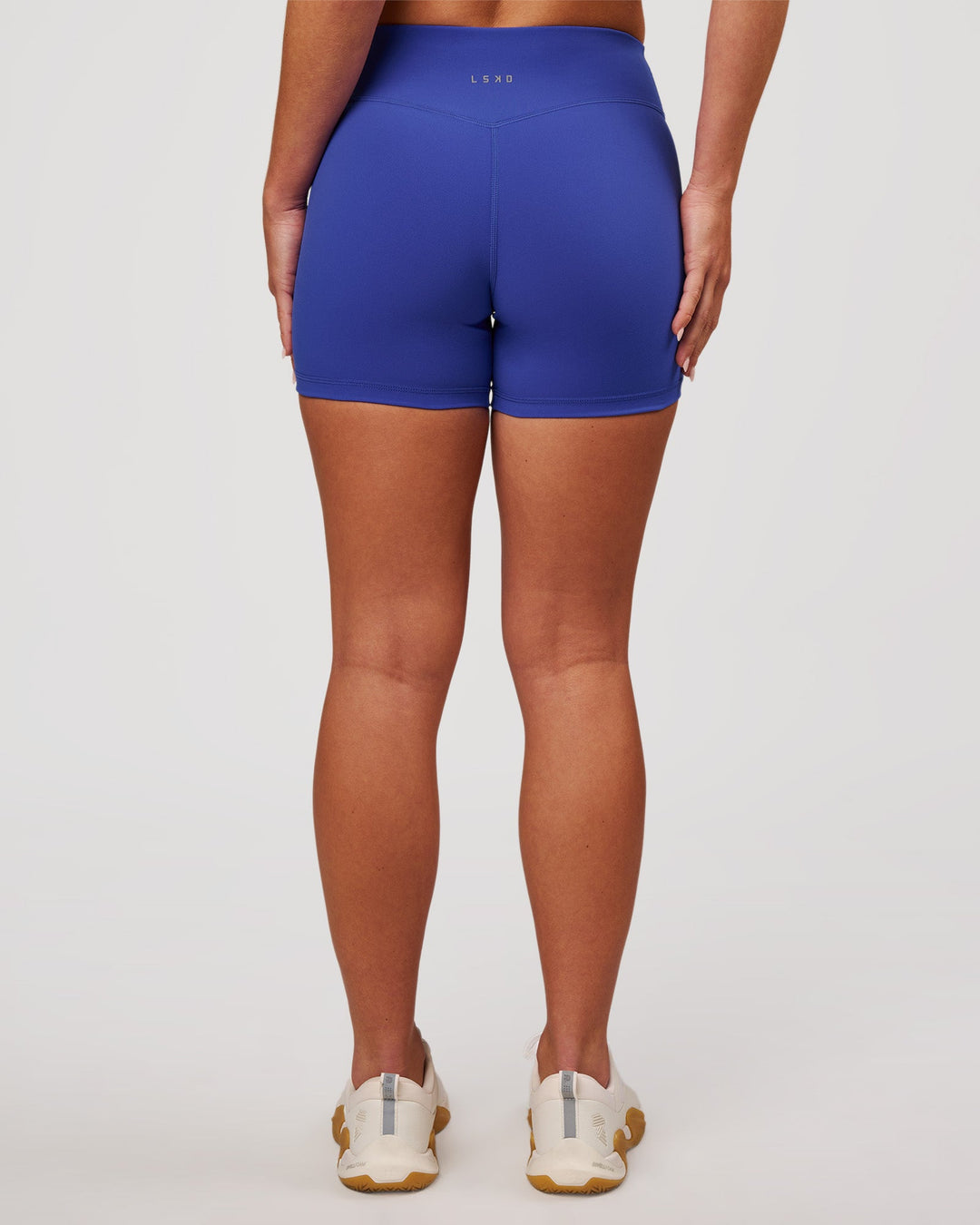 Woman wearing RXD Mid-Rise 4" Short - Power Cobalt | Model:Issy | Size:XS - view 4